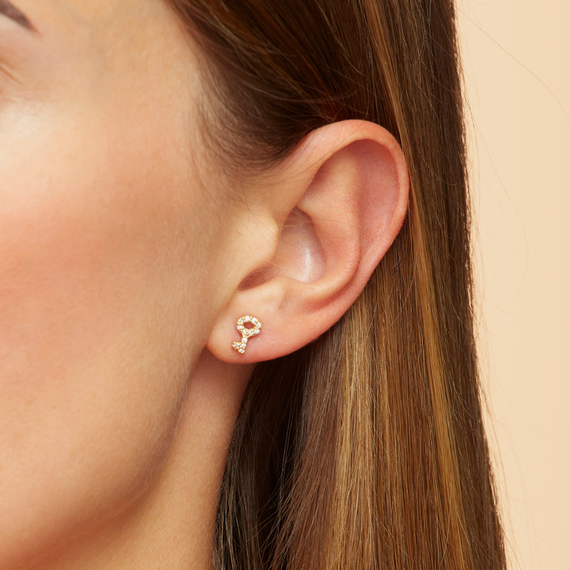 Our 14K gold diamond earring studs with a handset diamond pave are the ultimate love symbol. Lock and key diamond earrings.