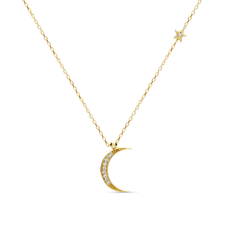 A magical 14 karat gold diamond necklace that will become your day to night companion. Moon magic diamond gold necklace.