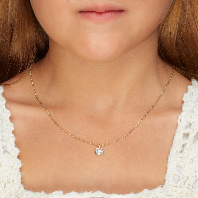 Our 14 karat gold flower necklace for girls features enamel hand painting in blue and white. Team it with the matching flower stud earring. 