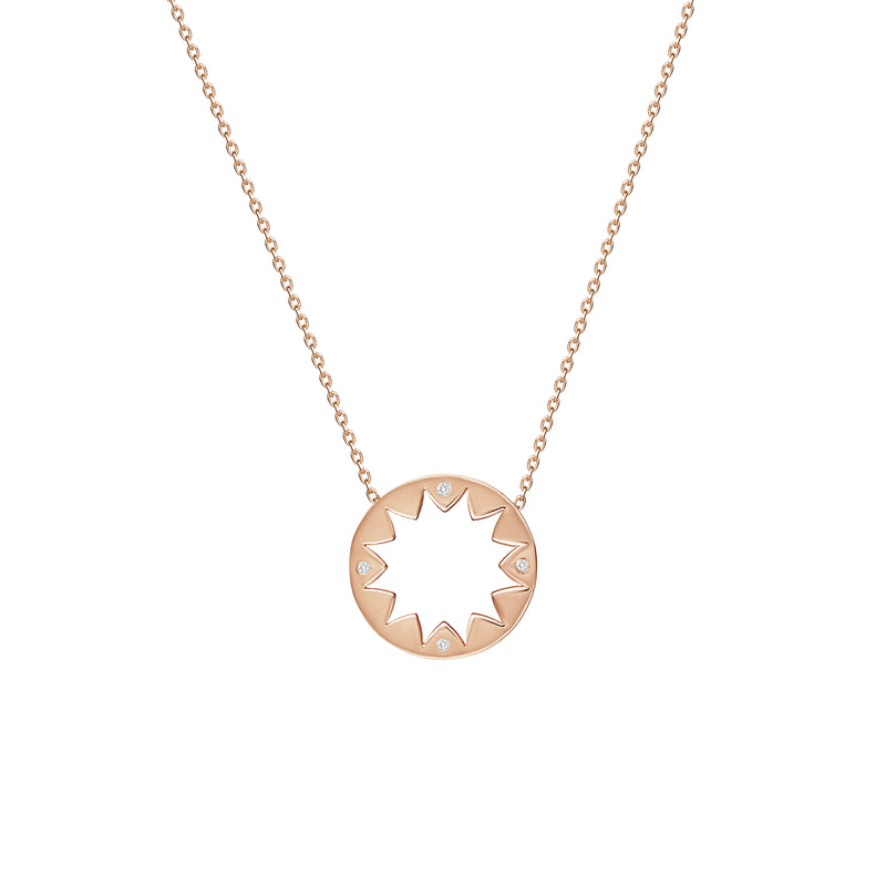 This 14 karat gold diamond pendant is inspired by mediterranean summer days and is the ultimate piece for sun-worshippers. The pendant features 4 handset sparkling diamonds pointing out the cardinal points. 