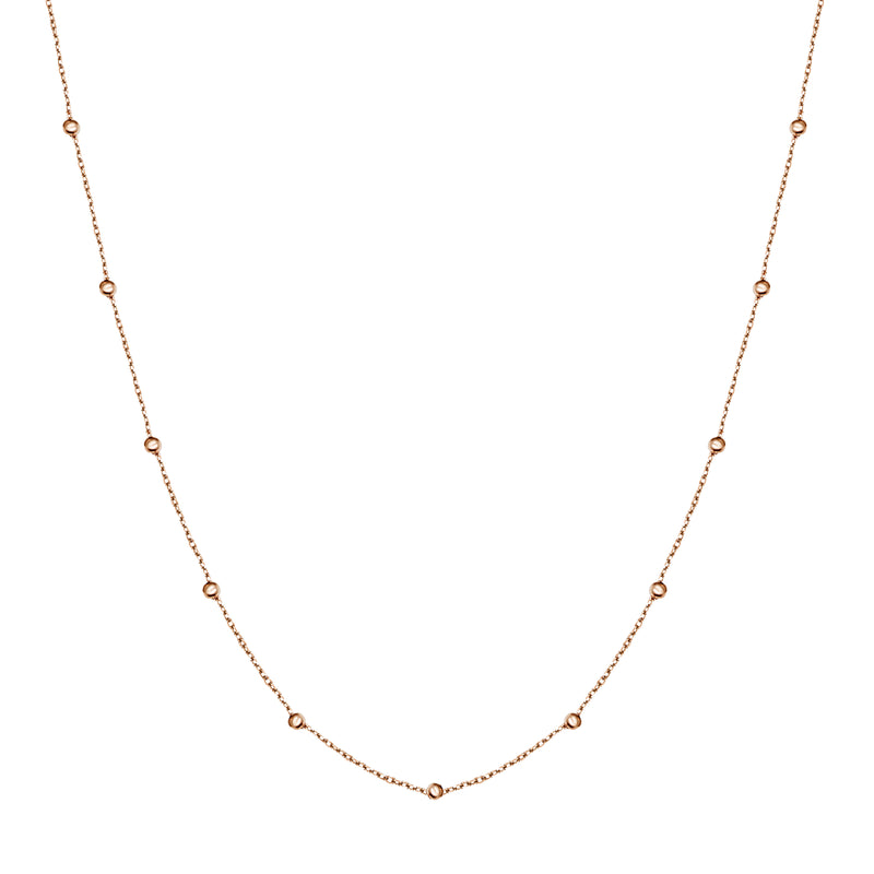 This ball chain necklace in 14 karat gold features petit balls aligned along the gold chain. Wear it by itself or combine with other gold necklaces for the ultimate layering look.