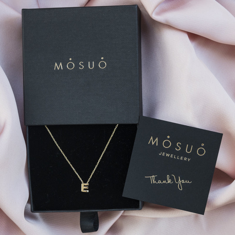A 18 karat gold vermeil necklace with your initial letter "E". This diamond letter necklace is a special jewelry necklace that can be worn day and night. A genuine diamond stone in the corner of the letter makes this gold diamond necklace a luxury and ideal gift for yourself, your best friend or loved one.