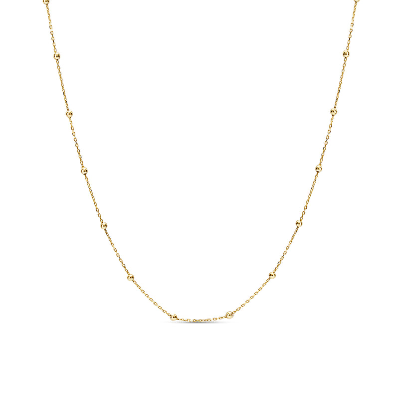 This ball chain necklace in 14 karat gold features petit balls aligned along the gold chain. Wear it by itself or combine with other gold necklaces for the ultimate layering look.