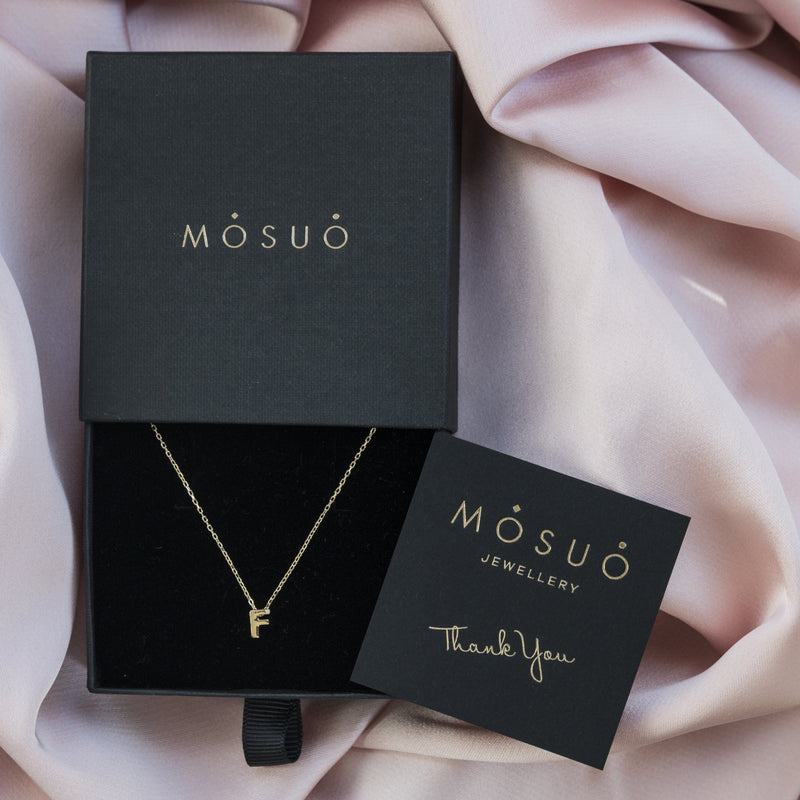 A 18 karat gold vermeil necklace with your initial letter "F". This diamond letter necklace is a special jewelry necklace that can be worn day and night. A genuine diamond stone in the corner of the letter makes this gold diamond necklace a luxury and ideal gift for yourself, your best friend or loved one.