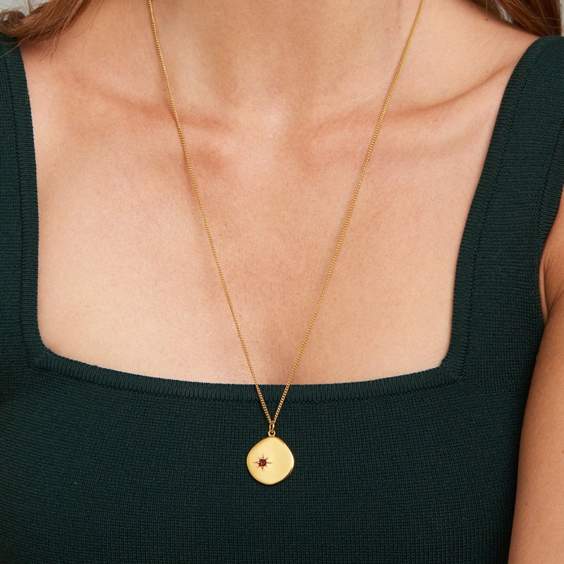 A new universe. The 18 Karat Gold Vermeil Birthstone Necklace shines with its garnet stone and long-lasting quality. Wear it as a symbol of your birth month January. This gold necklace is a perfect match for your everyday look. The long chain makes this necklace a perfect layering piece for a vibrant and extravagant look. Garnet, the January Birthstone is known as a symbol of love, passion and devotion.