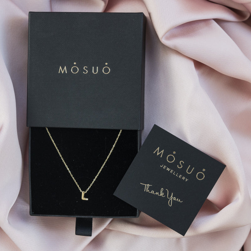 A 18 karat gold vermeil necklace with your initial letter "L". This diamond letter necklace is a special jewelry necklace that can be worn day and night. A genuine diamond stone in the corner of the letter makes this gold diamond necklace a luxury and ideal gift for yourself, your best friend or loved one. 