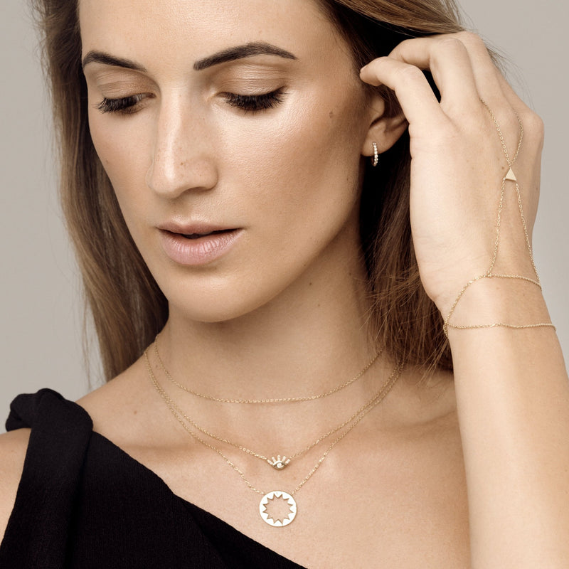 This handmade 14 karat gold bracelet is the ultimate gold accessory.   The fine and elegant 14k gold chain lays across the hand and delicately loops around the finger. You will be surprised how comfortable this bracelet is.