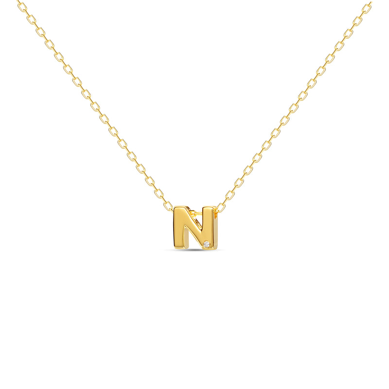 A 18 karat gold vermeil necklace with your initial letter "N". This diamond letter necklace is a special jewelry necklace that can be worn day and night. A genuine diamond stone in the corner of the letter makes this gold diamond necklace a luxury and ideal gift for yourself, your best friend or loved one. 