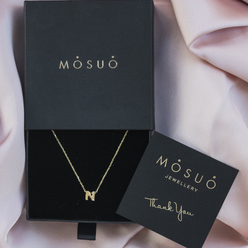 A 18 karat gold vermeil necklace with your initial letter "N". This diamond letter necklace is a special jewelry necklace that can be worn day and night. A genuine diamond stone in the corner of the letter makes this gold diamond necklace a luxury and ideal gift for yourself, your best friend or loved one.