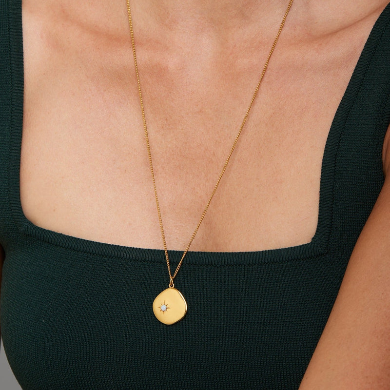 A new universe. The 18 Karat Gold Vermeil Birthstone Necklace shines with its opal stone and long-lasting quality. Wear it as a symbol of your birth month October. This gold necklace is a perfect match for your everyday look. The long chain makes this necklace a perfect layering piece for a vibrant and extravagant look. Opal, the October Birthstone is known as a symbol of hope, purity and love. This gemstone inspires positivity and transformation.