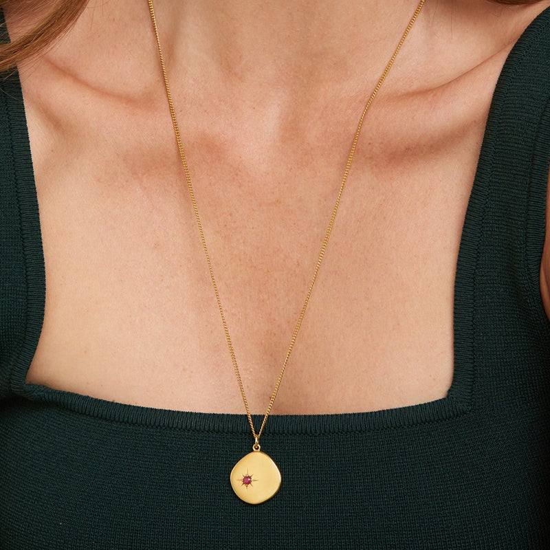 A new universe. The 18 Karat Gold Vermeil Birthstone Necklace shines with its ruby stone and long-lasting quality. Wear it as a symbol of your birth month July. This gold necklace is a perfect match for your everyday look. The long chain makes this necklace a perfect layering piece for a vibrant and extravagant look. Ruby, the July Birthstone is known as a symbol of passion and protection.