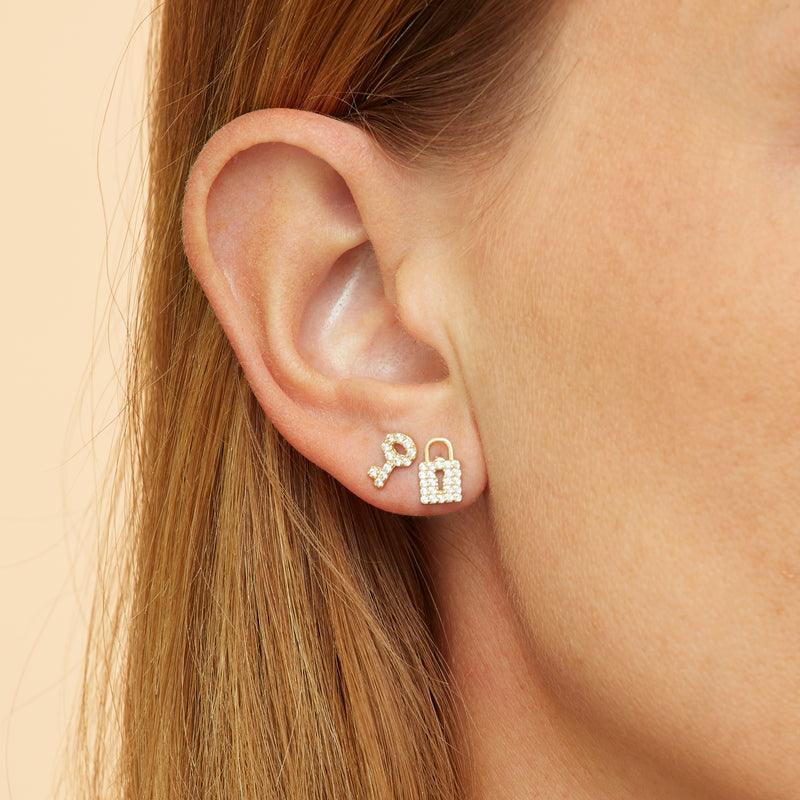 Our 14K gold diamond earring studs with a handset diamond pave are the ultimate love symbol. Lock and key diamond earrings.